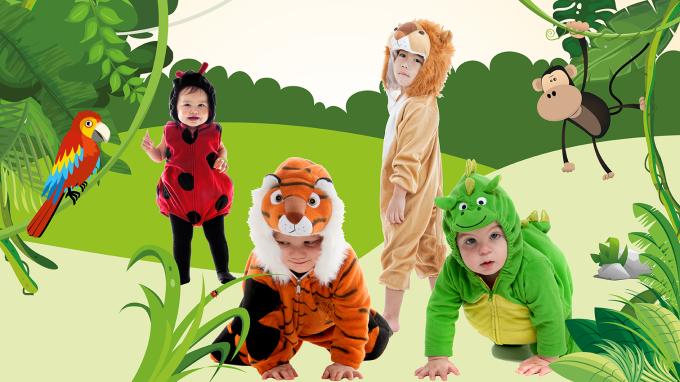 Young children dressed as furry animals in front of an animated jungle