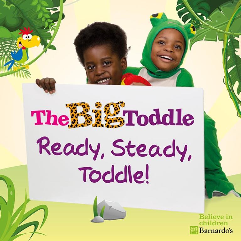 Two toddlers in animal costuems smiling with a sign saying The Big Toddle Ready Steady Toddle!