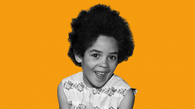 Old image of Julienne Wilding as a child, on orange background